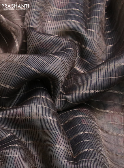 Tissue saree grey shade and black with allover zari woven stripes pattern and zari woven border - printed blouse