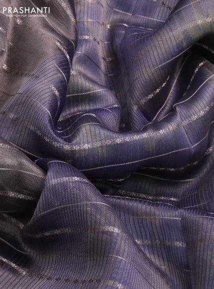 Tissue saree dual shade of grey and blue with allover zari woven stripes pattern and zari woven border - printed blouse