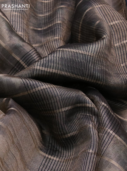 Tissue saree dual shade of grey and black with allover zari woven stripes pattern and zari woven border - printed blouse