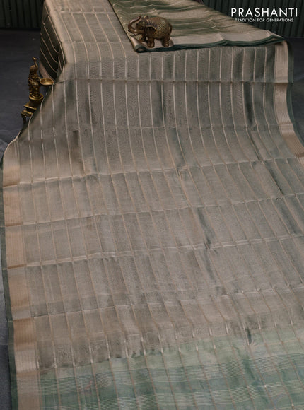 Tissue saree dual shade of green and green with allover zari woven stripes pattern and zari woven border - printed blouse