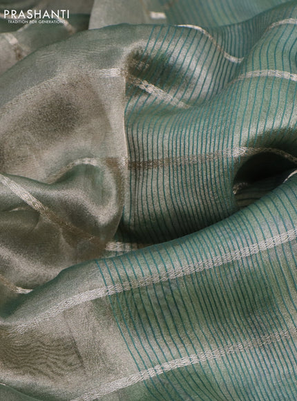 Tissue saree dual shade of green and green with allover zari woven stripes pattern and zari woven border - printed blouse