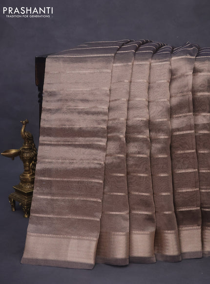 Tissue saree dual shade of grey and black with allover zari woven stripes pattern and zari woven border - printed blouse