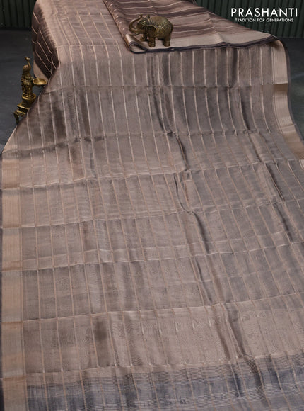 Tissue saree dual shade of grey and black with allover zari woven stripes pattern and zari woven border - printed blouse