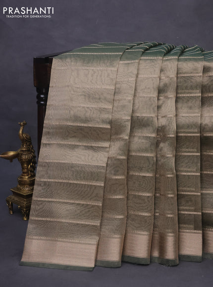 Tissue saree dual shade of green and green with allover zari woven stripes pattern and zari woven border - printed blouse