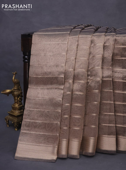 Tissue saree grey shade and black with allover zari woven stripes pattern and zari woven border - printed blouse