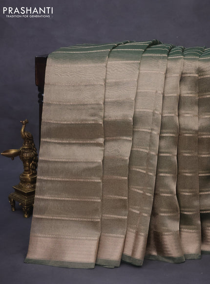 Tissue saree dual shade of green and green with allover zari woven stripes pattern and zari woven border - printed blouse