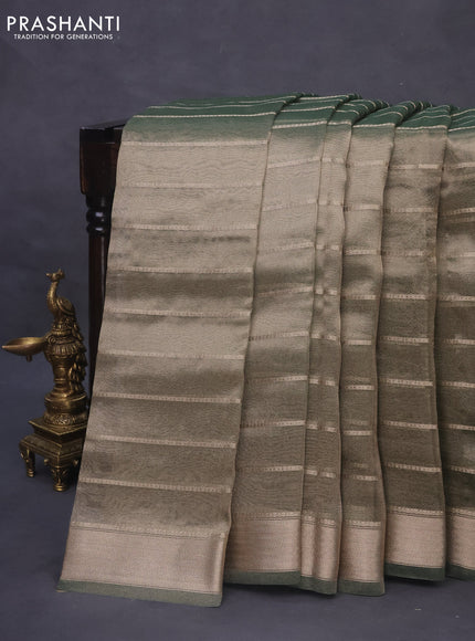 Tissue saree dual shade of green and green with allover zari woven stripes pattern and zari woven border - printed blouse