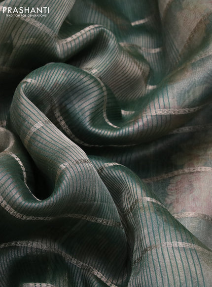 Tissue saree dual shade of green and green with allover zari woven stripes pattern and zari woven border - printed blouse