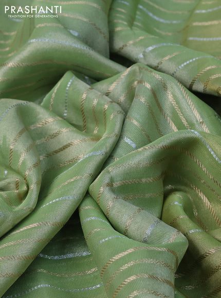 Tissue organza saree pista green with allover silver & gold zari weaves and zari woven border