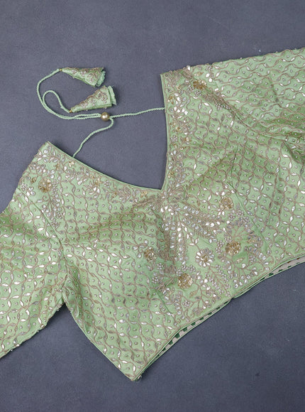 Tissue organza saree pista green with allover silver & gold zari weaves and zari woven border