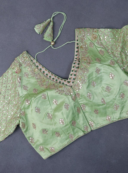 Tissue organza saree pista green with allover silver & gold zari weaves and zari woven border