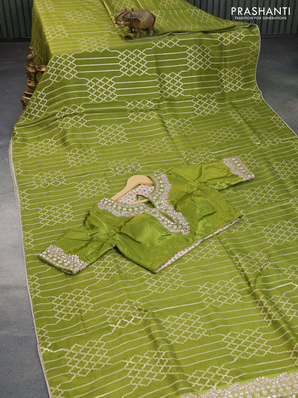 Munga tussar saree mehendi green with allover zari weaves and lace work blue