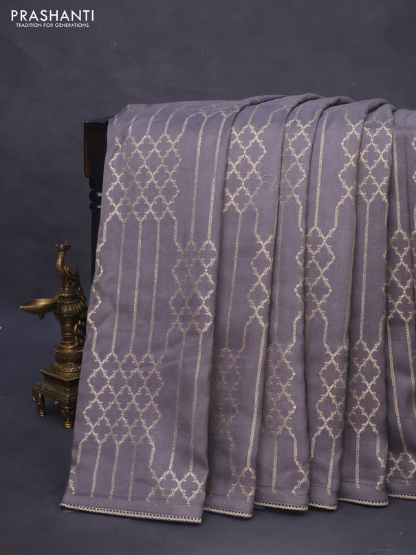 Munga tussar saree grey with allover zari weaves and lace work blue
