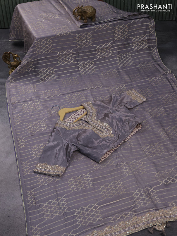 Munga tussar saree grey with allover zari weaves and lace work blue