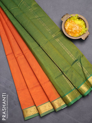 Silk cotton saree orange and green shade with plain body and small zari woven border