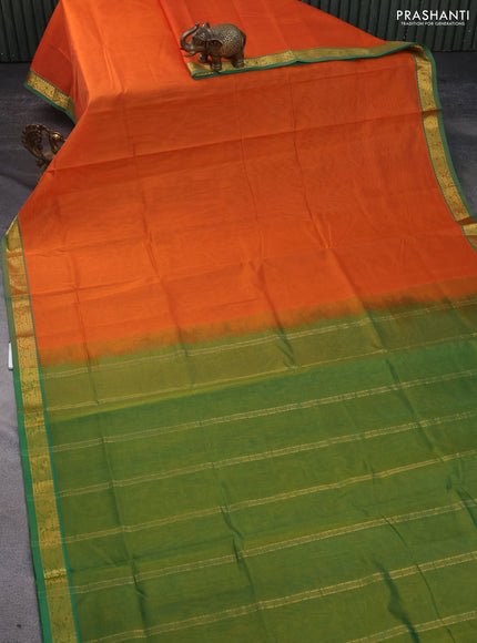 Silk cotton saree orange and green shade with plain body and small zari woven border