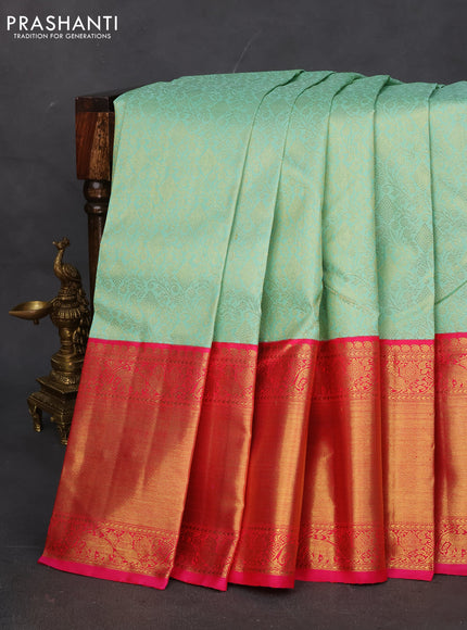Pure kanchipuram silk saree teal shade and pink with allover zari woven brocade weaves and long zari woven korvai border