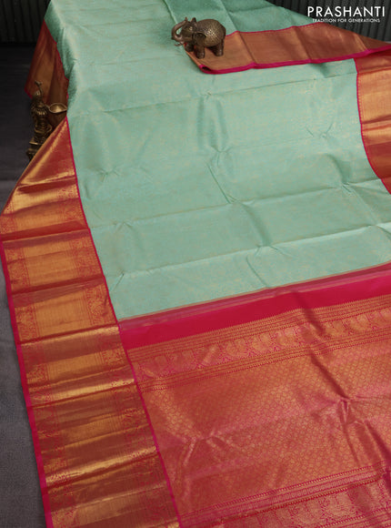 Pure kanchipuram silk saree teal shade and pink with allover zari woven brocade weaves and long zari woven korvai border