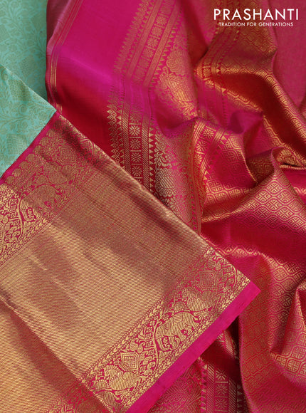 Pure kanchipuram silk saree teal shade and pink with allover zari woven brocade weaves and long zari woven korvai border