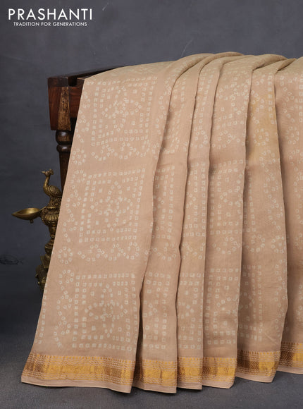 Chanderi bagru saree beige and blue with allover bandhani prints & ajrakh printed pallu and zari border & ajrakh printed pallu