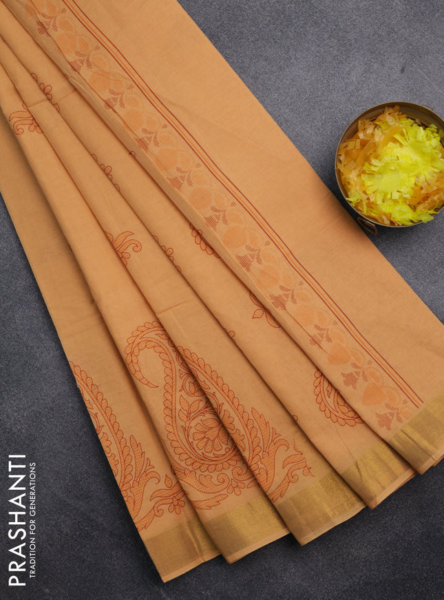 Chirala cotton saree pale orange with butta prints and paisley printed zari border