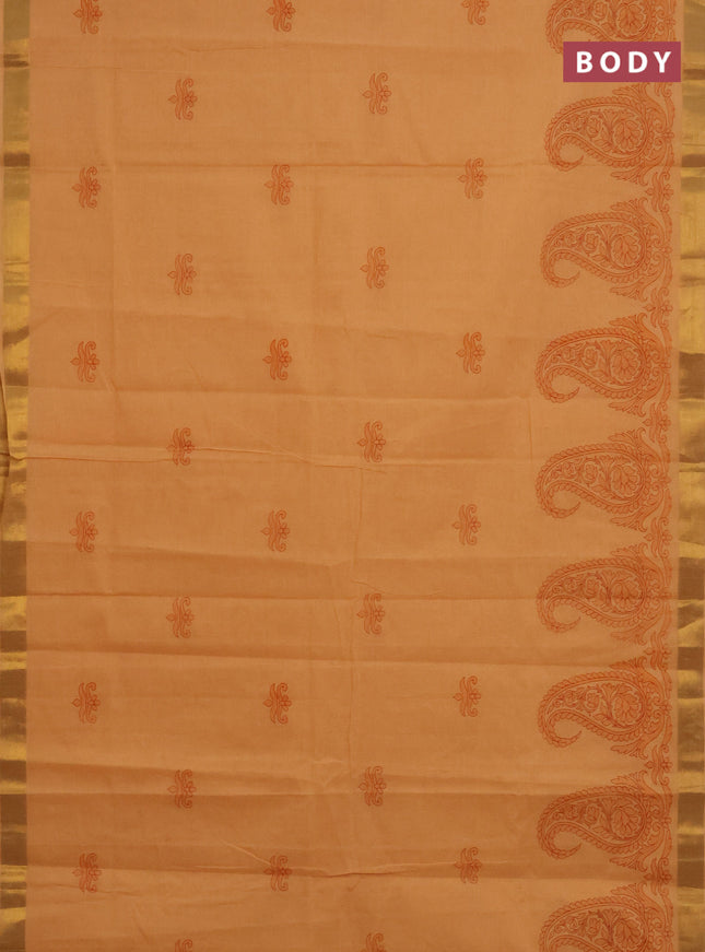 Chirala cotton saree pale orange with butta prints and paisley printed zari border