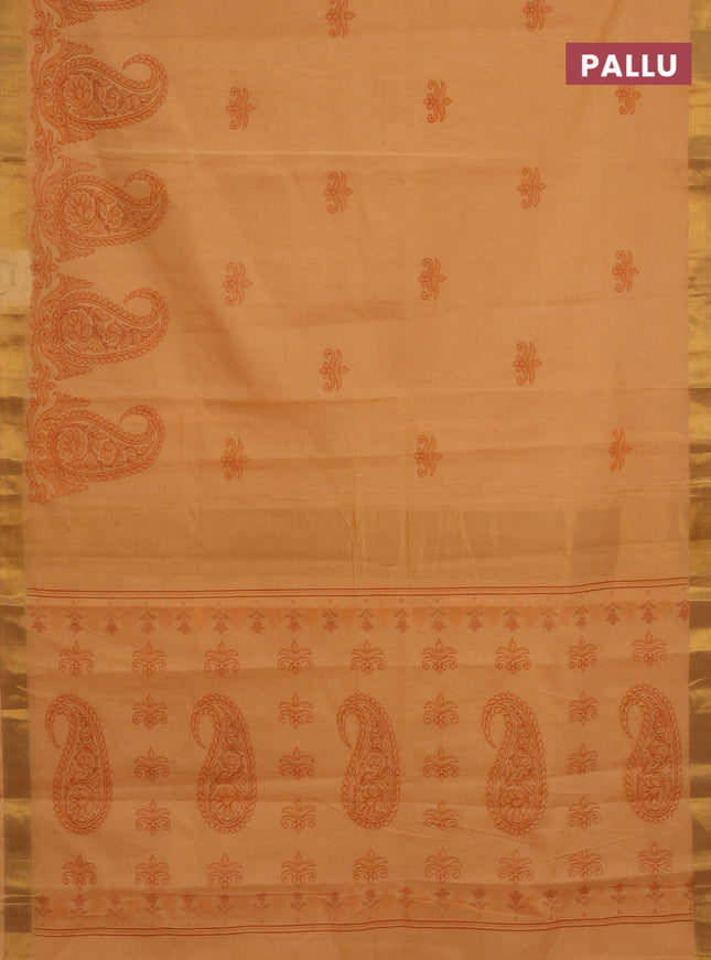 Chirala cotton saree pale orange with butta prints and paisley printed zari border