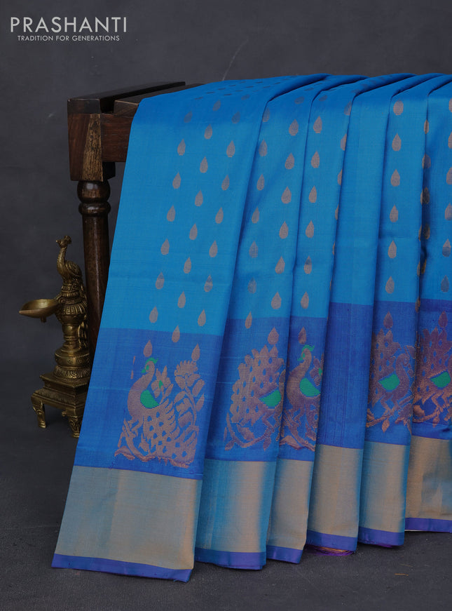 Pure uppada silk saree cs blue and violet with allover zari woven thilak buttas and peacock design zari woven border