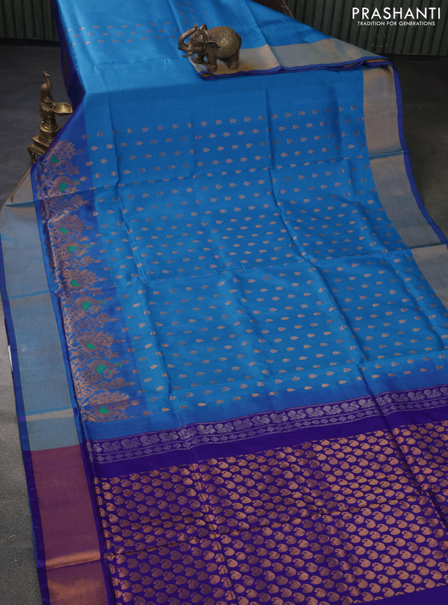 Pure uppada silk saree cs blue and violet with allover zari woven thilak buttas and peacock design zari woven border
