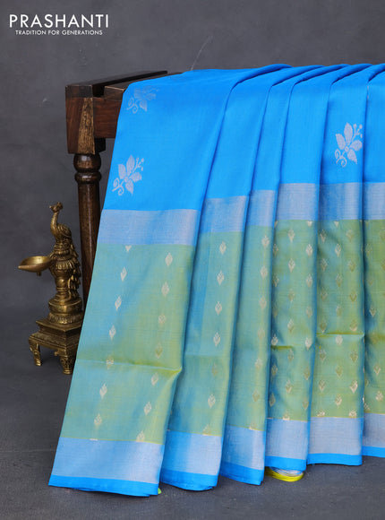 Pure uppada silk saree cs blue and dual shade of lime green with allover silver zari woven floral buttas and long silver zari woven paisley butta border