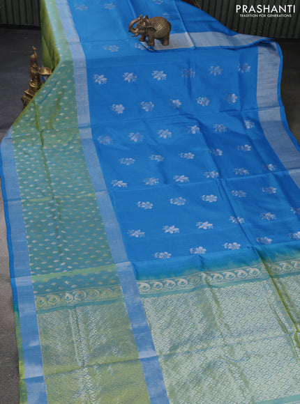 Pure uppada silk saree cs blue and dual shade of lime green with allover silver zari woven floral buttas and long silver zari woven paisley butta border