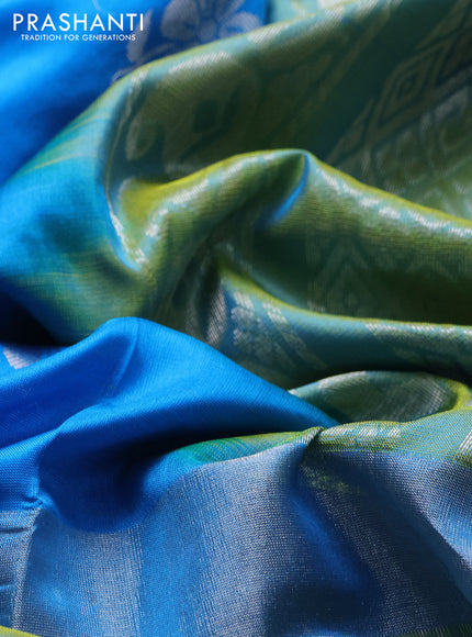 Pure uppada silk saree cs blue and dual shade of lime green with allover silver zari woven floral buttas and long silver zari woven paisley butta border