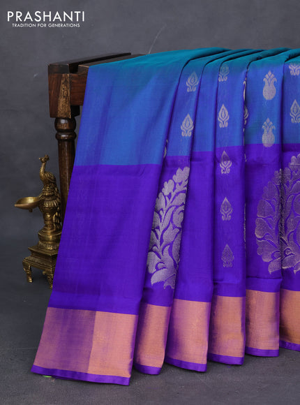 Pure uppada silk saree dual shade of bluish green and violet with allover silver zari woven buttas and long paisley design zari woven border