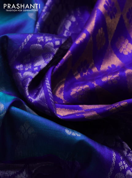 Pure uppada silk saree dual shade of bluish green and violet with allover silver zari woven buttas and long paisley design zari woven border