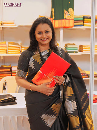 Pure kanchipuram silk saree black with plain body and temple design zari woven border