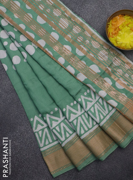 Semi chanderi saree pastel green and off white with batik prints and zari woven border
