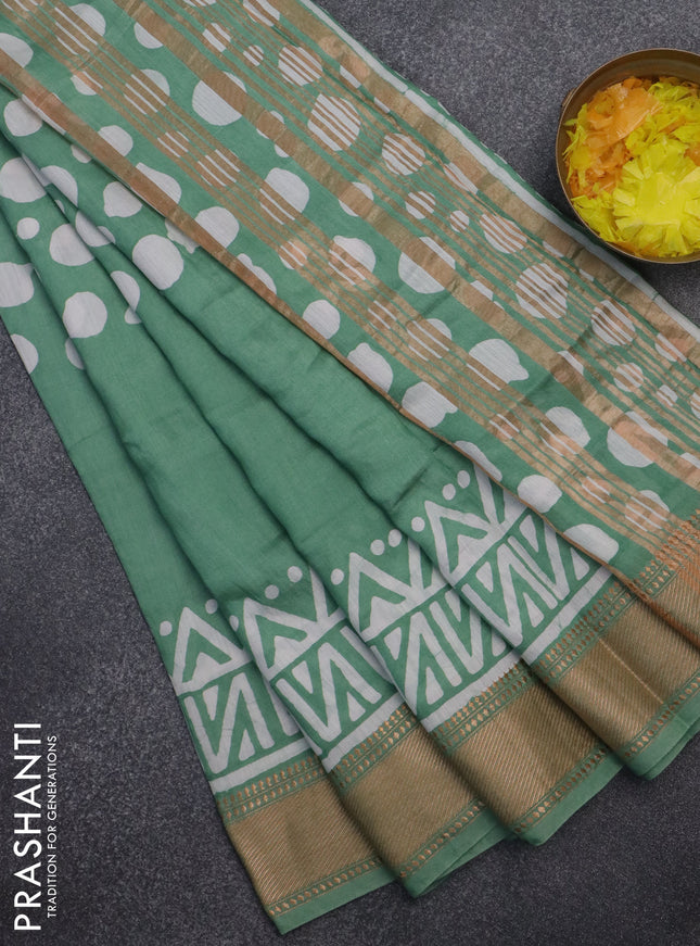 Semi chanderi saree pastel green and off white with batik prints and zari woven border