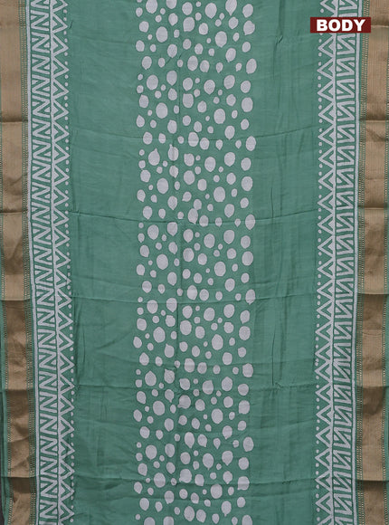 Semi chanderi saree pastel green and off white with batik prints and zari woven border