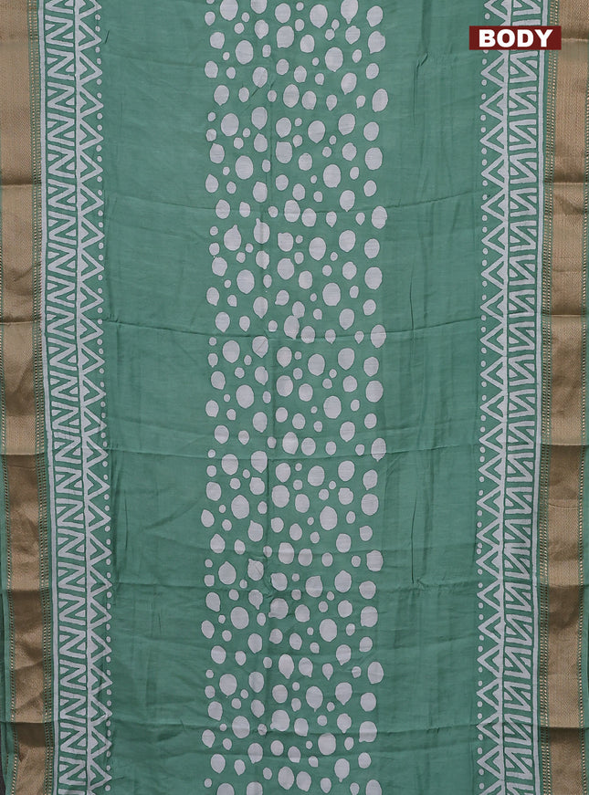 Semi chanderi saree pastel green and off white with batik prints and zari woven border