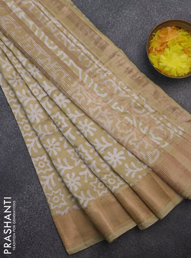 Semi chanderi saree sandal and off white with allover batik prints and zari woven border