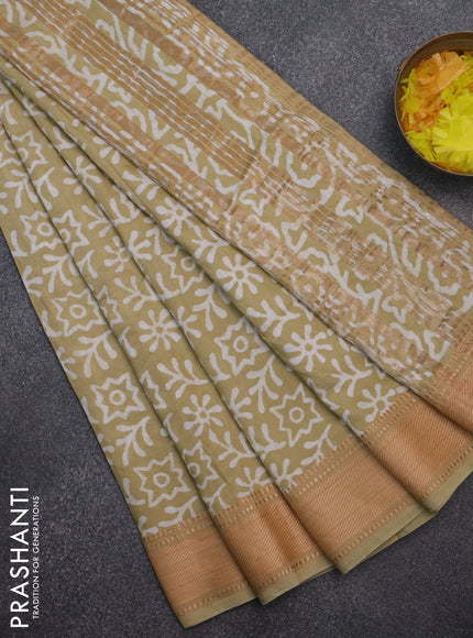 Semi chanderi saree sandal and off white with allover batik prints and zari woven border