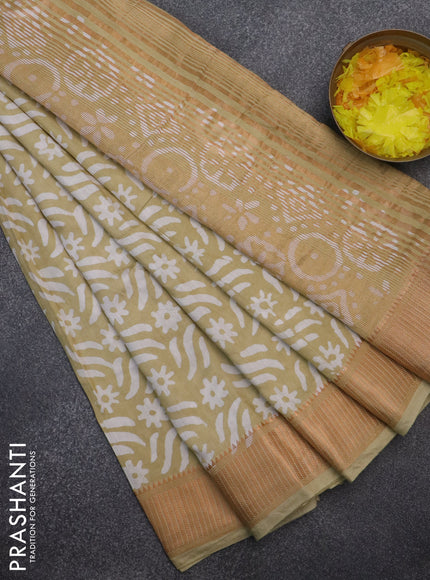 Semi chanderi saree sandal and off white with allover batik prints and zari woven border