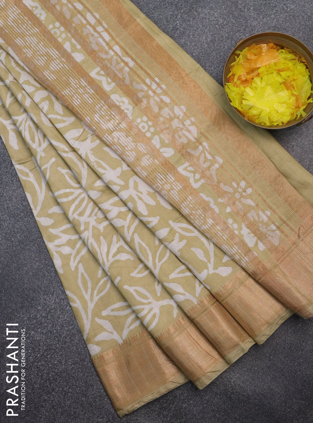 Semi chanderi saree sandal and off white with allover batik prints and zari woven border