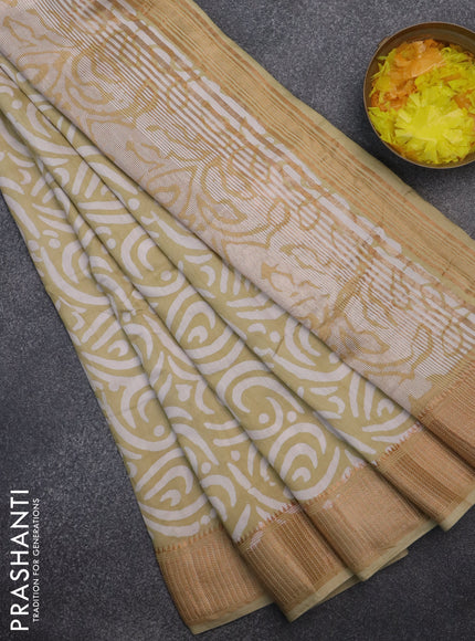 Semi chanderi saree sandal and off white with allover batik prints and zari woven border