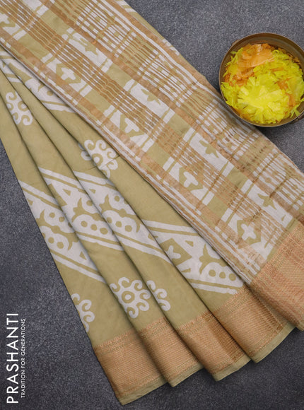 Semi chanderi saree sandal and off white with allover batik prints and zari woven border
