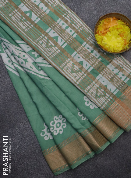 Semi chanderi saree pastel green and off white with allover batik prints and zari woven border