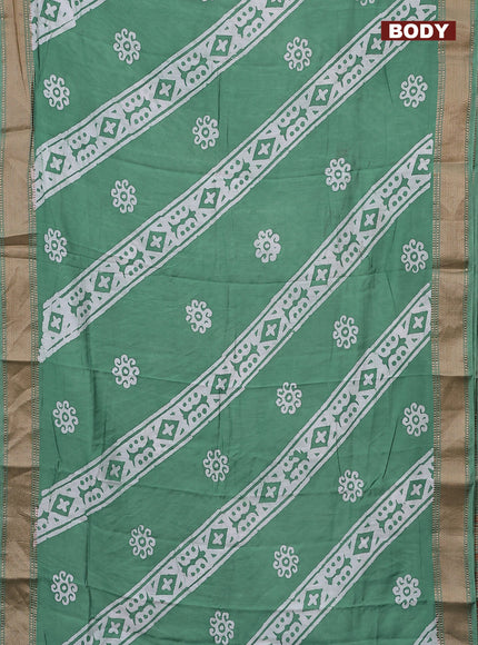 Semi chanderi saree pastel green and off white with allover batik prints and zari woven border