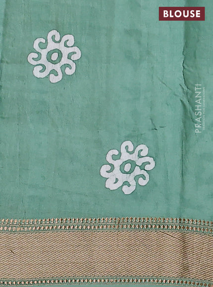 Semi chanderi saree pastel green and off white with allover batik prints and zari woven border