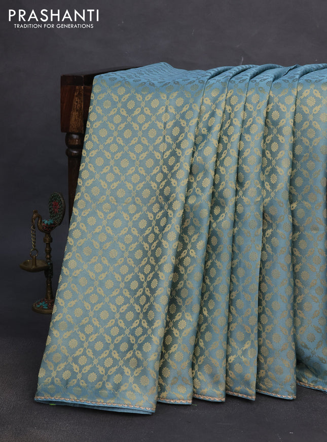 Banarasi semi crepe saree pastel blue with allover zari woven brocade weaves and lace work border