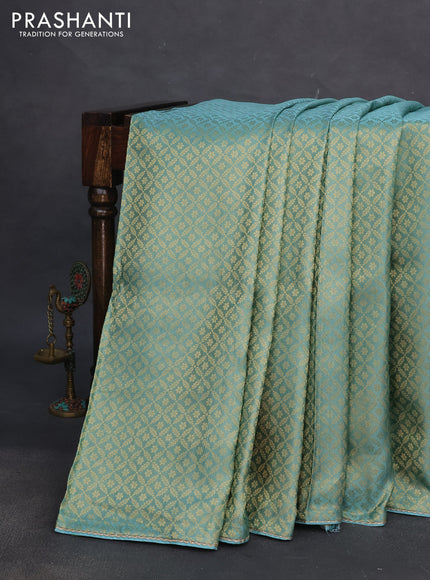 Banarasi semi crepe saree teal blue shade with allover zari woven brocade weaves and lace work border